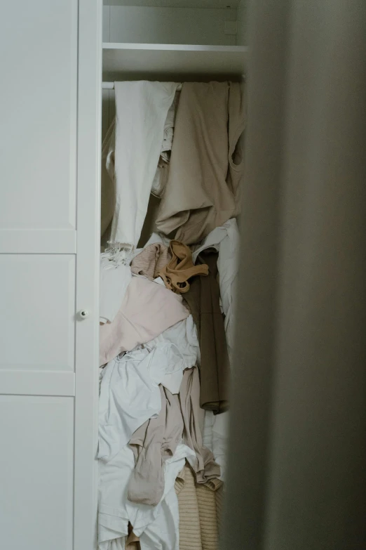 a white closet filled with lots of clothes, by Matija Jama, unsplash, renaissance, ruffled and tattered dress, earthy light pastel colours, minimal palette, made of fabric