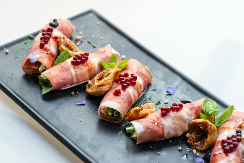 a close up of a plate of food on a table, by Tom Bonson, unsplash, mingei, covered with organic flesh, stuffed, sparkling, bandoliers