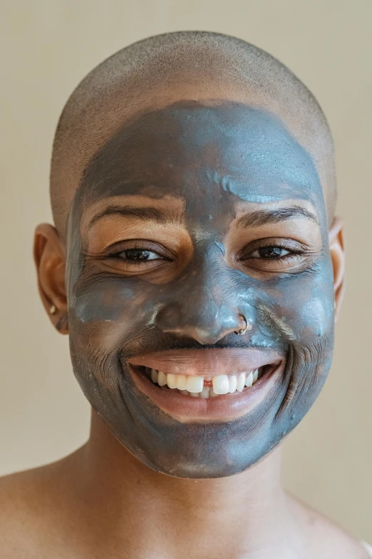 a close up of a person with a face mask, looking happy, charcoal color skin, genderless, smooth blue skin