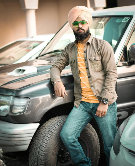 a man sitting on the hood of a truck, inspired by Manjit Bawa, pexels contest winner, dau-al-set, square, ready to model, profile image, car shot