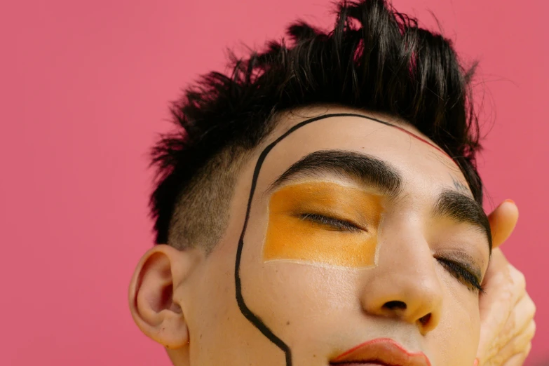 a close up of a person with a painted face, an album cover, inspired by Russell Dongjun Lu, trending on pexels, androgynous male, relaxed eyebrows, half asian, face cluse - up
