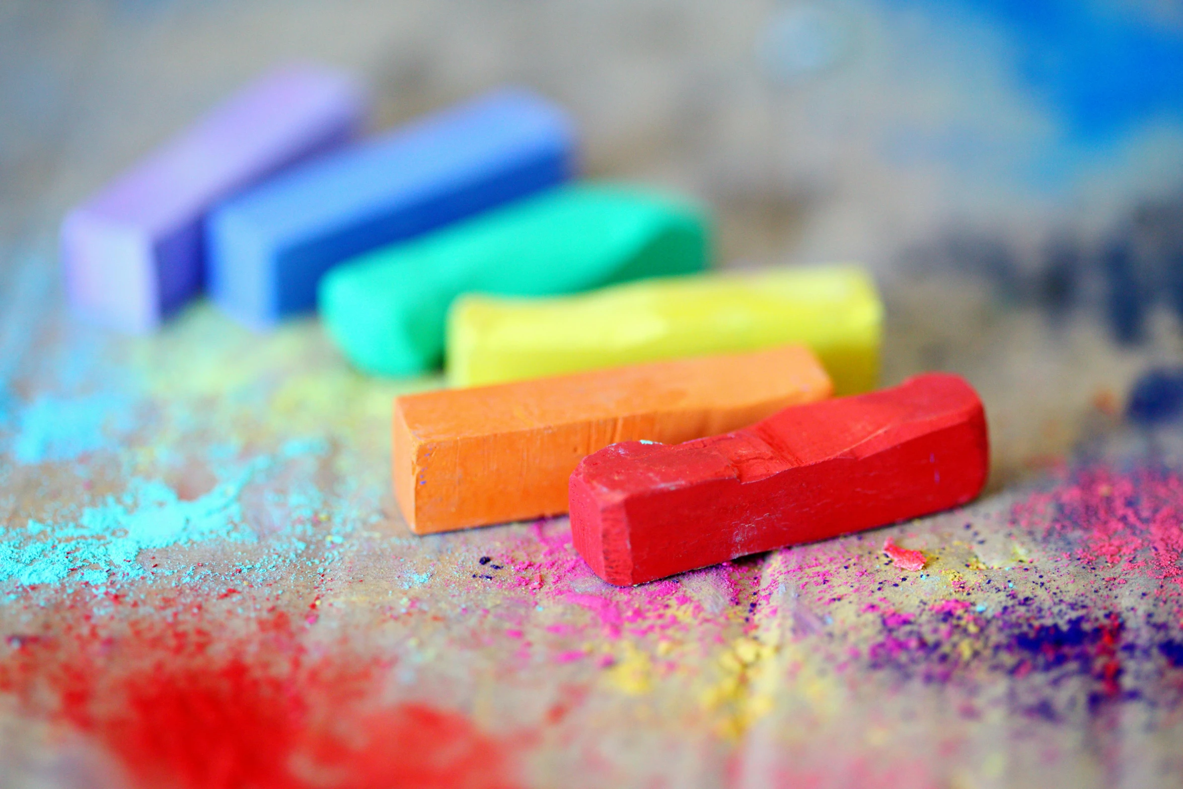 a close up of a bunch of crayons on a table, chalk art, by Helen Stevenson, trending on pexels, made of clay, building blocks, chalky, roygbiv