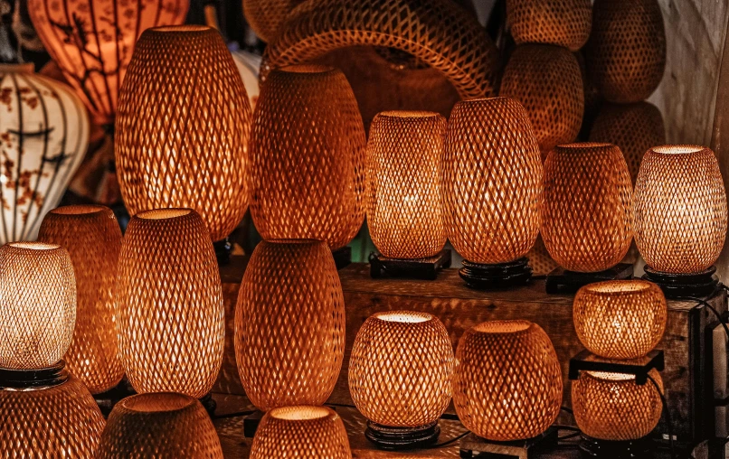 a bunch of vases sitting on top of a shelf, glowing paper lanterns, intricate carved wood, vietnam, fantastic lighting and shading