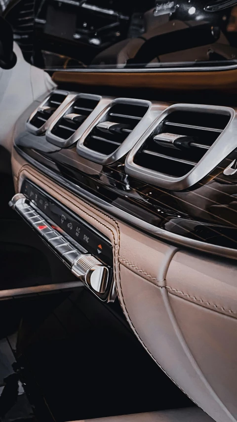 a close up of the dashboard of a car, an album cover, inspired by Elsa Bleda, pexels contest winner, modernism, air conditioner, square, silver, high quality photo