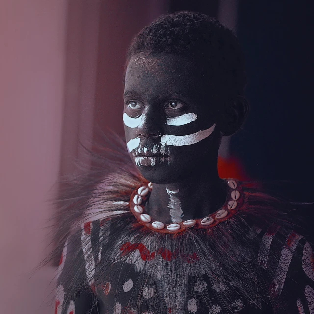 a close up of a person with a painted face, by Béla Nagy Abodi, pexels contest winner, afrofuturism, full body 8k, young child, imogen poots as a holy warrior, unmistakably kenyan