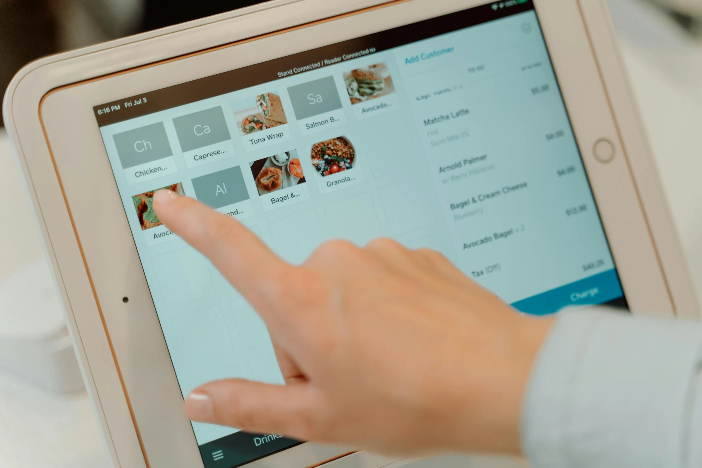 a person pointing to a menu on a tablet, square, thumbnail, 8, ecommerce photograph