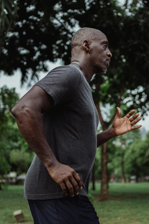 a man throwing a frisbee in a park, pexels contest winner, happening, man is with black skin, lance reddick, depressed dramatic bicep pose, instagram story