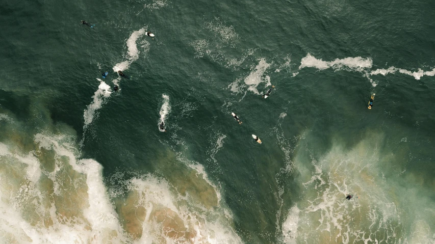a group of people riding surfboards on top of a wave, by Adam Marczyński, pexels contest winner, satellite view, thumbnail, battered, 15081959 21121991 01012000 4k