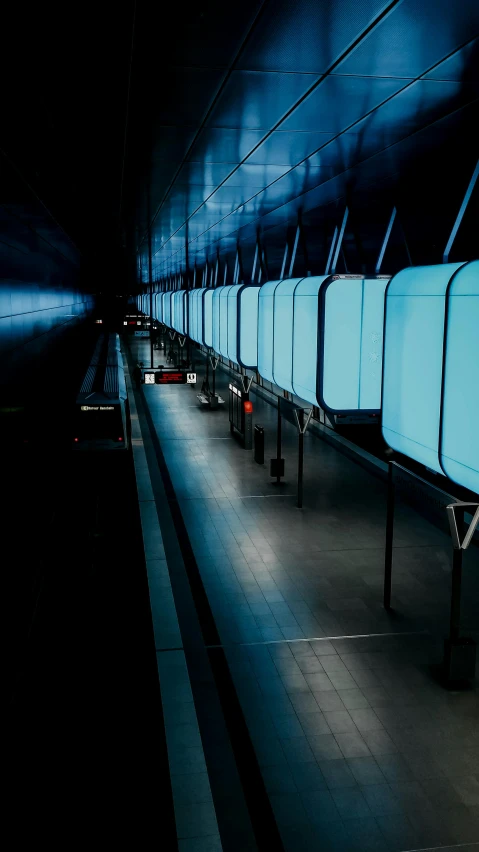a couple of benches sitting next to each other, an album cover, inspired by Andreas Gursky, conceptual art, futuristic cyber subway station, blue color grading, light-blue, square