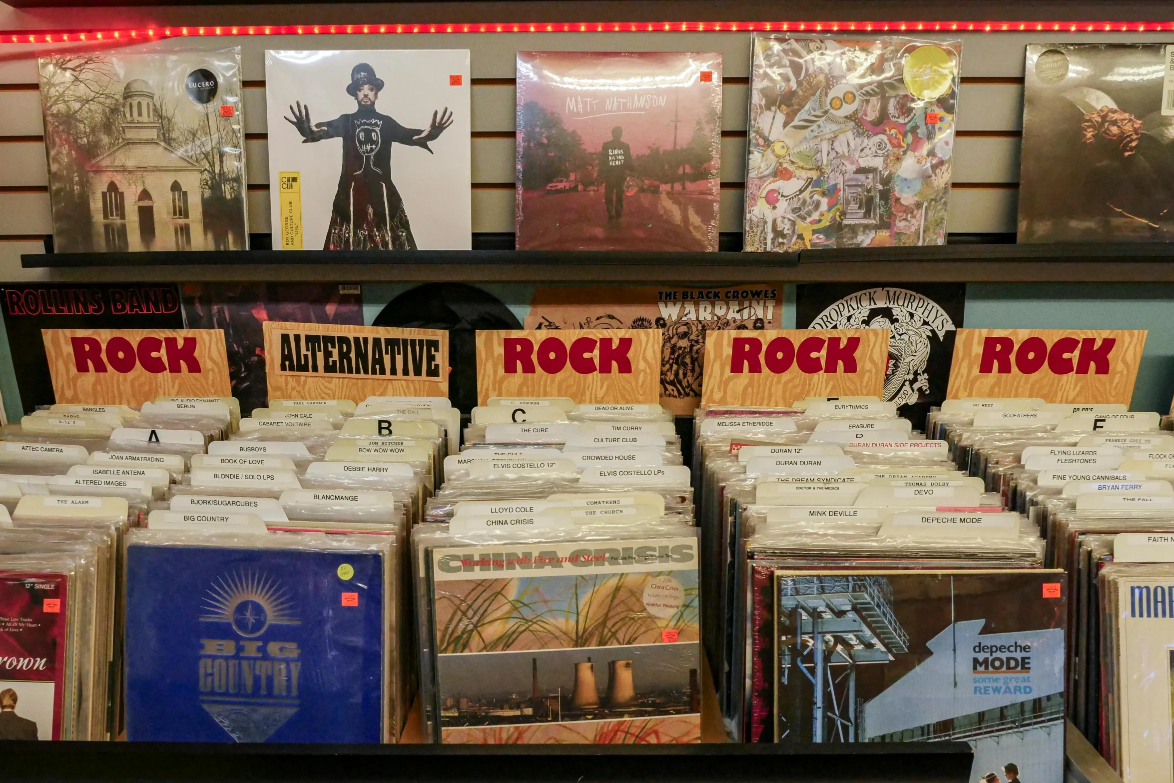 a bunch of records on a shelf in a store, an album cover, high rocks, thumbnail, 1 2 9 7