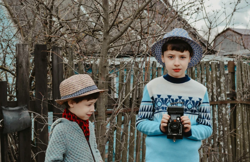 a couple of young boys standing next to each other, a picture, pexels contest winner, style of wes anderson, ukraine. professional photo, 15081959 21121991 01012000 4k, instagram picture