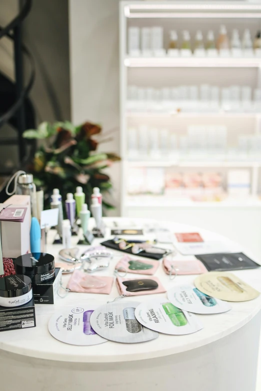 a table with a lot of beauty products on it, happening, chemical woekshop, bags under eyes, wide shot, press