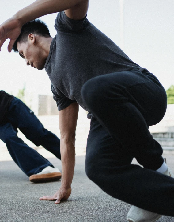 a group of young men doing tricks on skateboards, pexels contest winner, happening, two muscular men entwined, thumbnail, wearing pants and a t-shirt, non-binary