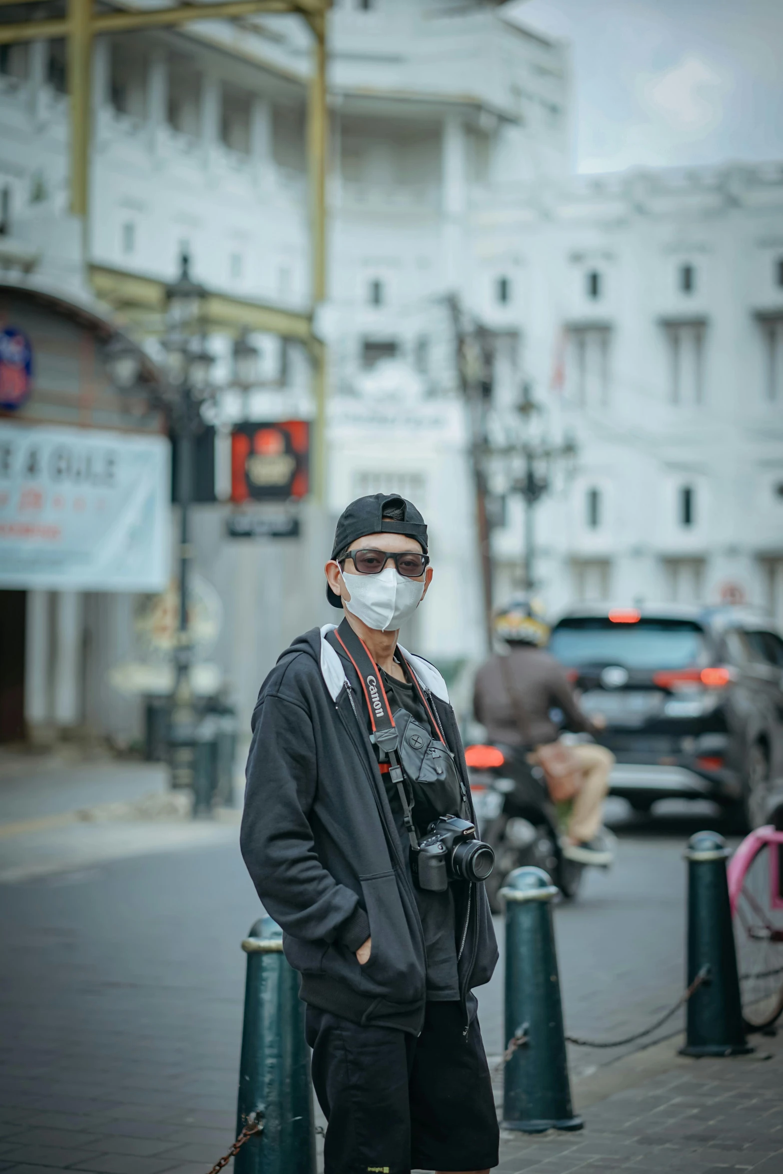 a man wearing a face mask on a city street, a picture, by Abidin Dino, unsplash, visual art, wearing victorian goggles, full body in camera, square, asian male