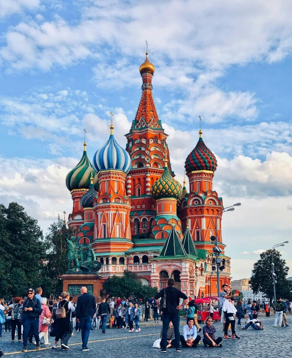 a group of people that are standing in front of a building, inspired by Vasily Surikov, pexels contest winner, socialist realism, colourful biomorphic temple, spires, 🚿🗝📝, lgbt