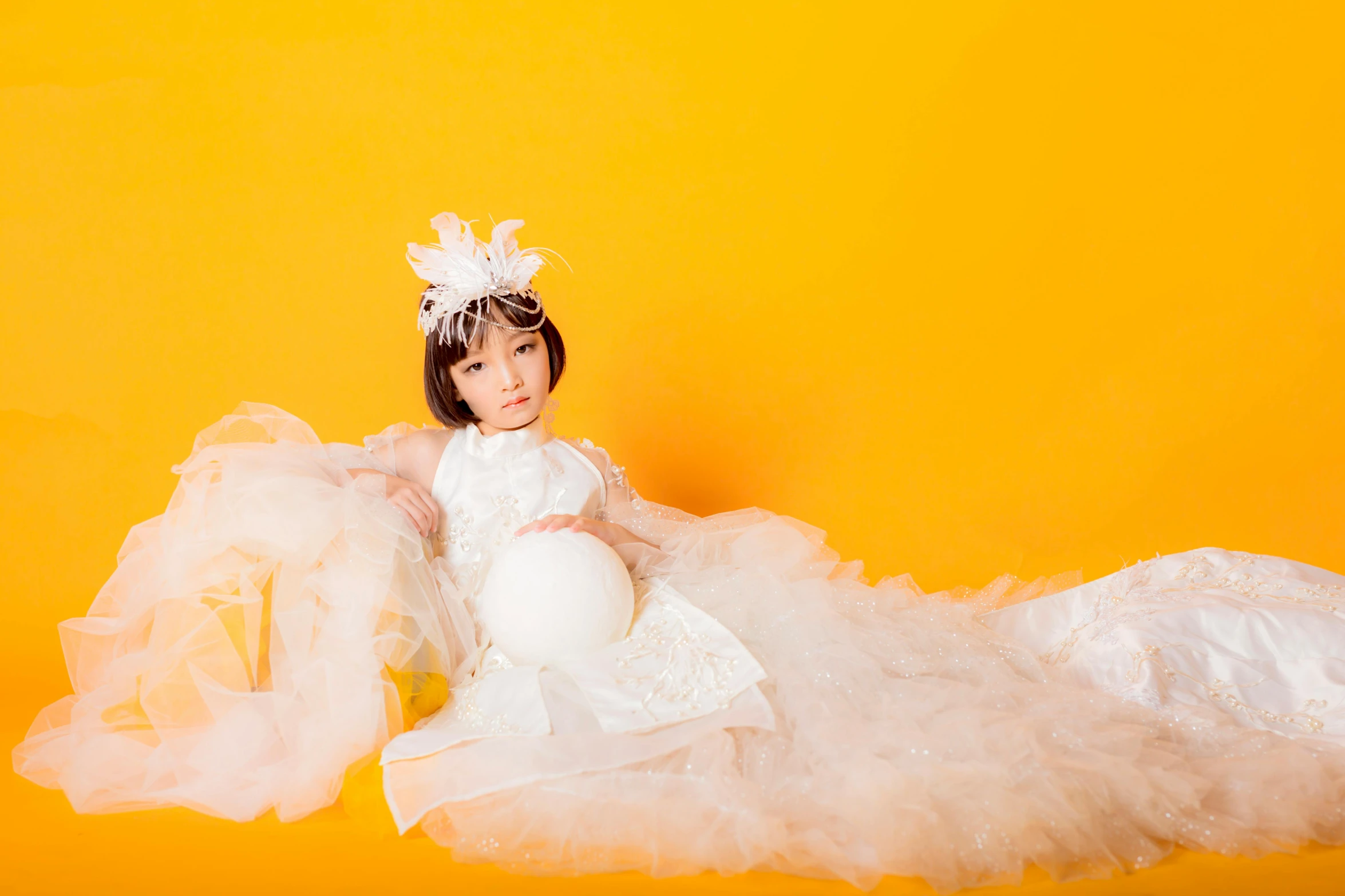 a little girl in a white dress on a yellow background, inspired by Tang Di, pexels contest winner, rei hino as a princess, 15081959 21121991 01012000 4k, studio shoot, orange and white