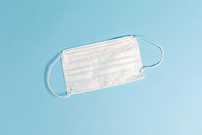 a medical mask on a blue background, by Ellen Gallagher, plasticien, white cummerbund, without text, product image, background removed