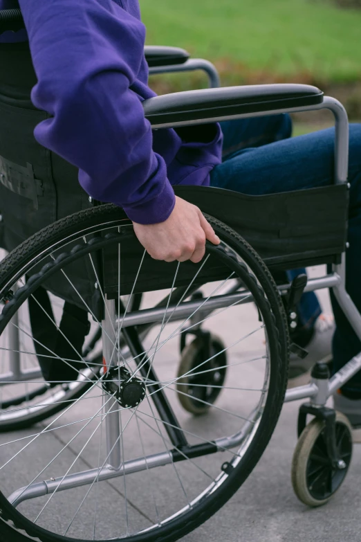 a close up of a person in a wheel chair, purple, digital image, wheels, rectangle