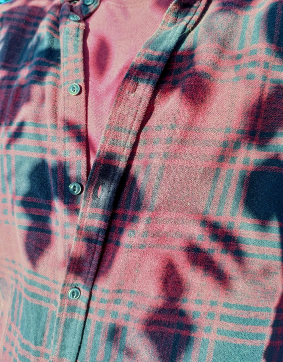 a close up of a person wearing a tie dye shirt, an album cover, inspired by Rudolf von Alt, unsplash, wearing a flannel shirt, mauve and cinnabar and cyan, thumbnail, detailed zoom photo