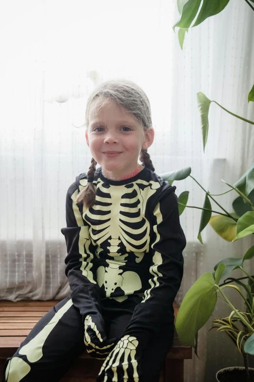 a little girl sitting on top of a wooden bench, anatomically accurate skeleton, glow in the dark, long sleeve, olya bossak