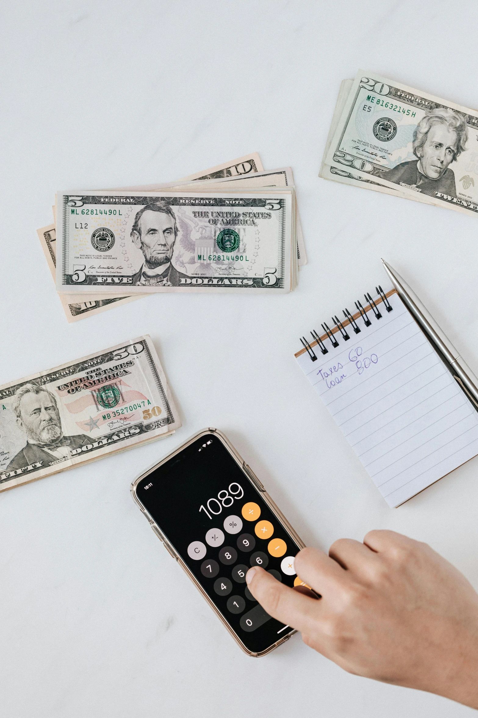 a person using a calculator next to a pile of money, a photo, by Byron Galvez, trending on pexels, 🚀🌈🤩, instagram story, on white paper, kailee mandel