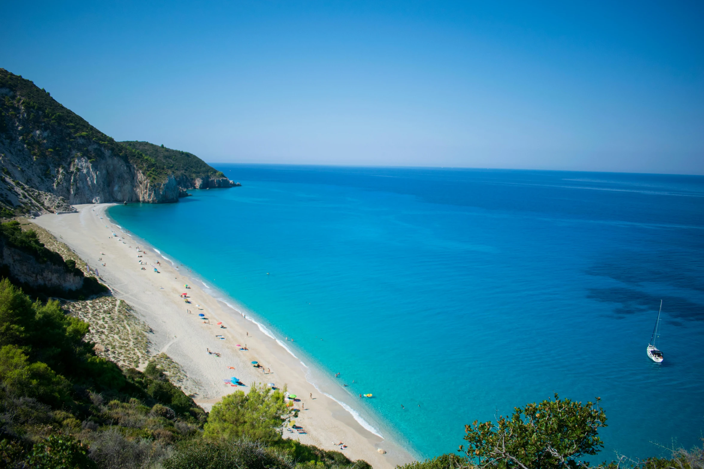 a view of a beach from the top of a hill, by Julian Allen, pexels contest winner, hurufiyya, crystal clear blue water, square, george patsouras, southern european scenery