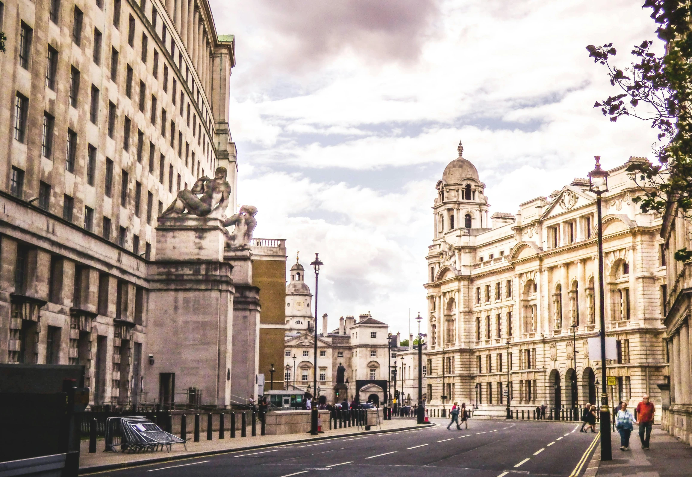 a group of people walking down a street next to tall buildings, inspired by Christopher Wren, pexels contest winner, baroque, on a great neoclassical square, portcullis, beautiful high resolution, royal academy