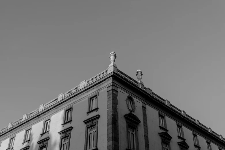 a black and white photo of a tall building, a black and white photo, pexels contest winner, neoclassicism, orazio gentileschi style, photography hight quality, rooftop, architecture carved