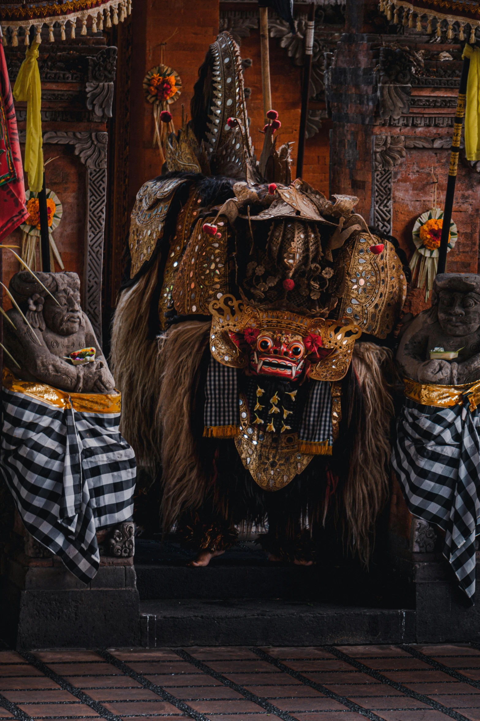 a group of people that are standing in front of a building, inspired by I Ketut Soki, pexels contest winner, sumatraism, ornate mask and fabrics, in a throne room, cinematic close shot, barong family