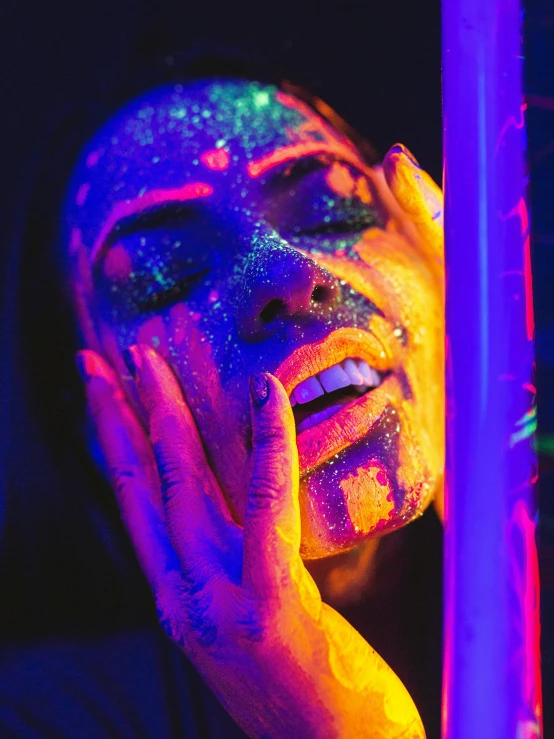 a close up of a person with neon paint on their face, inspired by David LaChapelle, trending on pexels, transgressive art, glitter accents on figure, bisexual lighting, with beautiful colors, ( colorful )