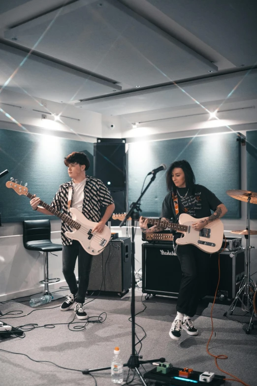 a group of people that are playing guitars, an album cover, unsplash, set on singaporean aesthetic, in intergalactic hq, profile image, teenage