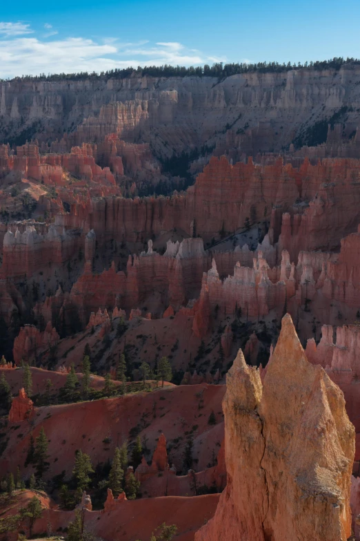 a large rock formation in the middle of a canyon, by David Simpson, gigapixel photo, majestic spires, late summer evening, slide show