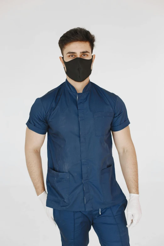 a man wearing a surgical mask and gloves, by Matija Jama, reddit, uniform background, attractive neck, dentist, tunic