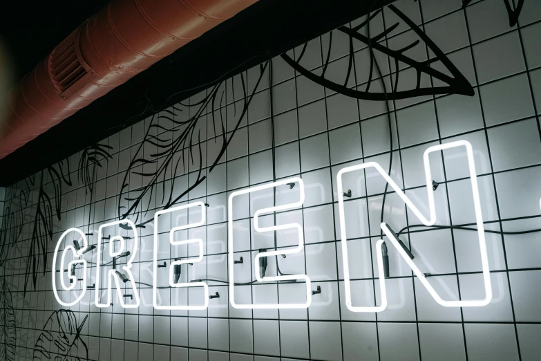 a close up of a neon sign on a wall, trending on pexels, green energy, greed, evergreen, unreal engine'