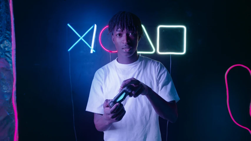 a man holding a video game controller in front of a neon sign, inspired by Xanthus Russell Smith, pexels contest winner, lyco art, playboi carti portrait, 2 1 savage, hyperrealistic image of x, teenage engineering moad