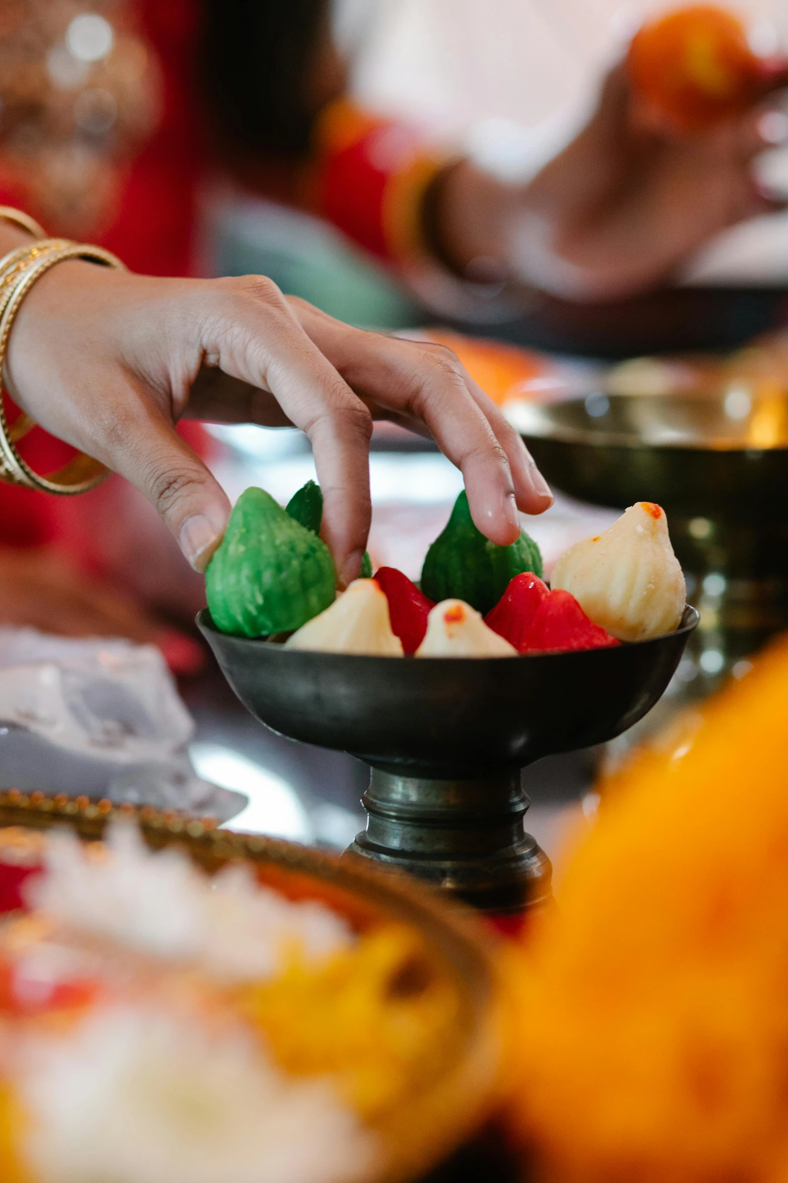 a close up of a bowl of food on a table, ceremonial, anjali mudra, candy decorations, wētā fx