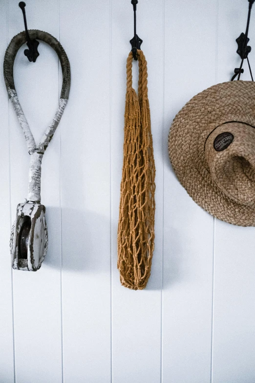 a bunch of hats hanging on a wall, inspired by Joseph Beuys, unsplash, coastal, detail shot, lasso tool, white background