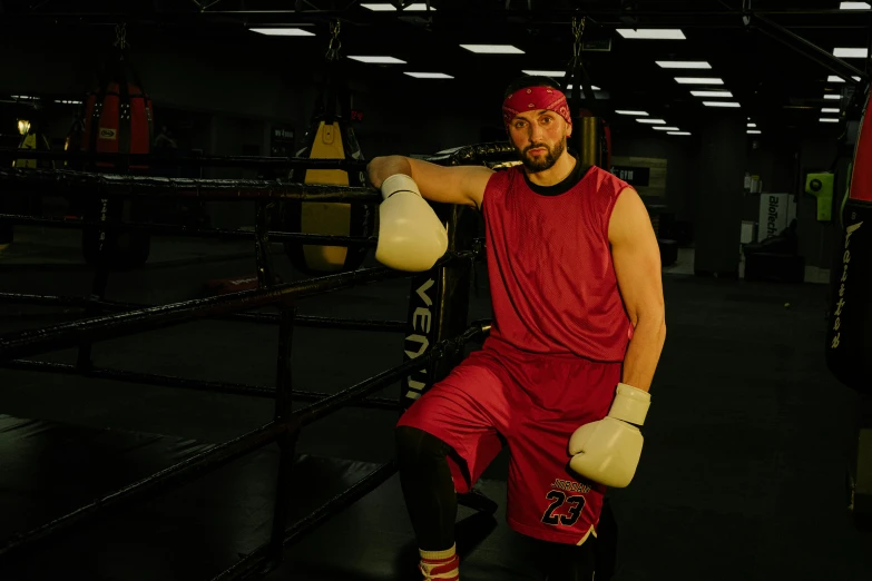 a man posing for a picture in a boxing ring, profile image, maroon, game ready, 8ft tall