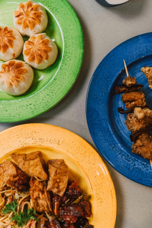 a number of plates of food on a table, inspired by Mi Fu, trending on unsplash, mingei, blue, malaysian, 3 - piece, thumbnail