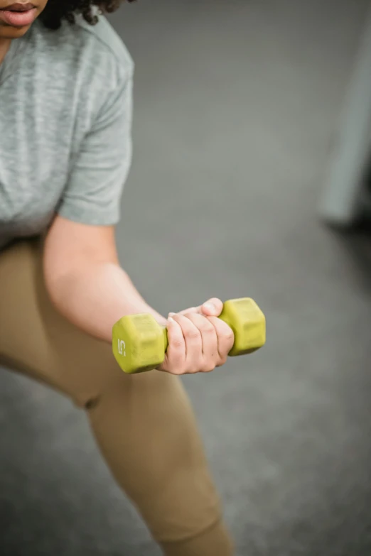 a woman squatting with a pair of green dumbs, pexels contest winner, private press, closeup of arms, six sided, square, clinical