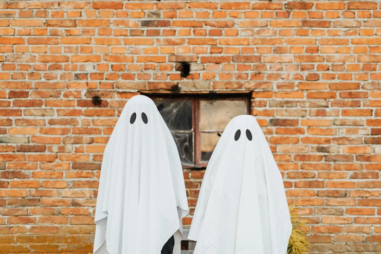 two ghosts standing in front of a brick building, pexels contest winner, authentic costume, white, rex orange county, blank