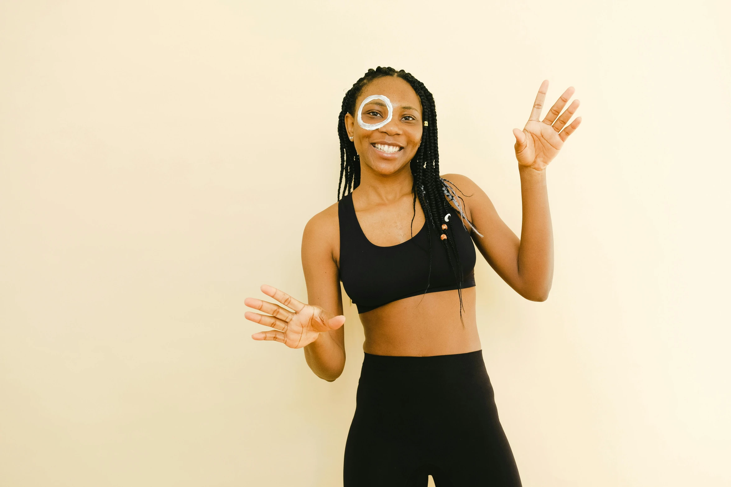 a woman in a sports bra top posing for a picture, pexels contest winner, happening, smiling mask, black woman, circle face, tape