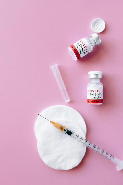 a syll, a syll and a needle on a pink background, a picture, trending on pexels, blood collection vials, steroid use, cosmopolitan, white and red color scheme