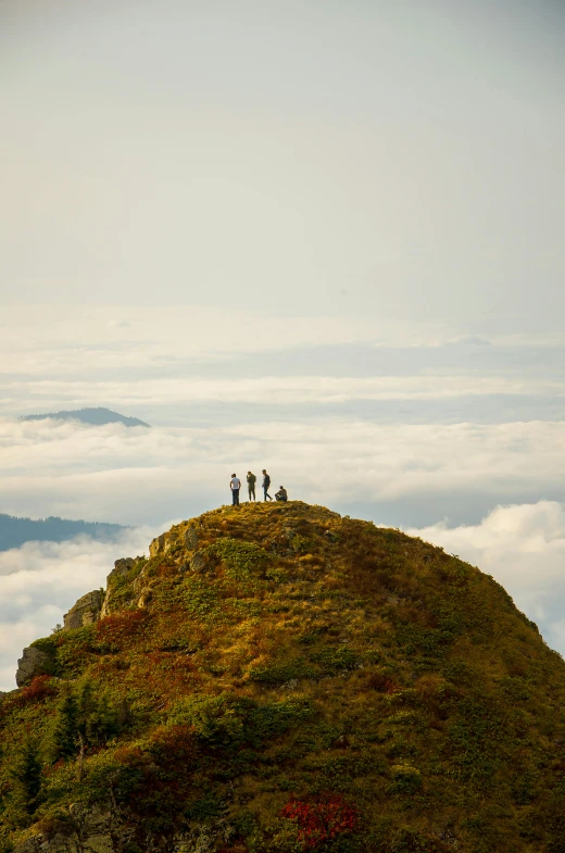 a group of people standing on top of a mountain, by Peter Churcher, sumatraism, philippines, sri lanka, big sky, f / 2 0