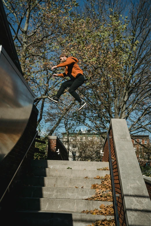 a man flying through the air while riding a skateboard, by Jacob Burck, unsplash, happening, doing a kickflip over stairs, autumn season, live-action archival footage, slide show