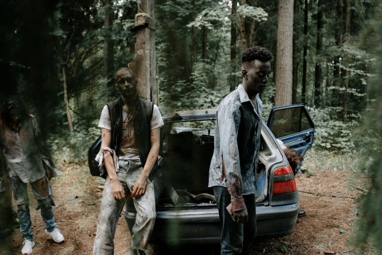 a group of people standing next to a car, an album cover, pexels contest winner, visual art, dead forest, two young men, xxxtentacion, medium shot of two characters