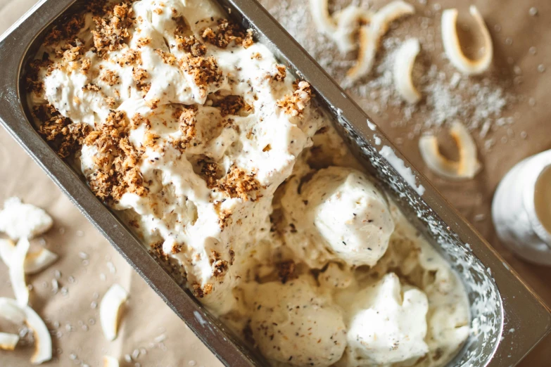 a pan of ice cream sitting on top of a table, with lots of details, curls, epicurious, thumbnail