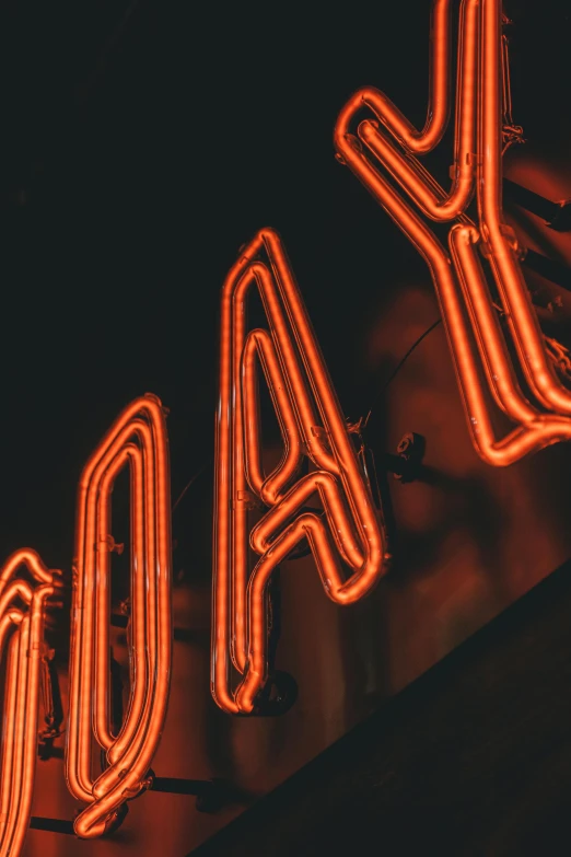 a close up of a neon sign on a building, orange ray, x - day, speakeasy, profile image