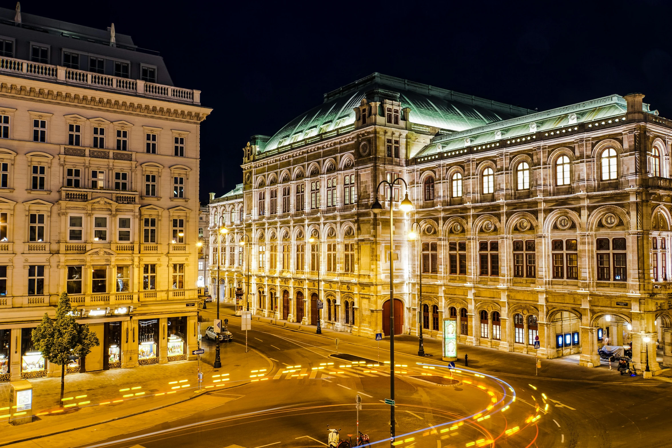 a city street filled with lots of tall buildings, viennese actionism, vienna state opera house, at night, profile image, square