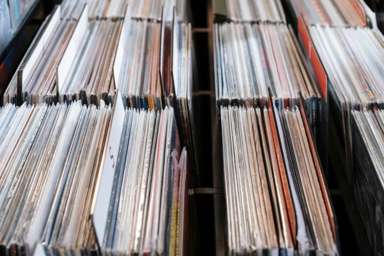 a bunch of records stacked on top of each other, an album cover, unsplash, racks, stereogram, stems, cardboard